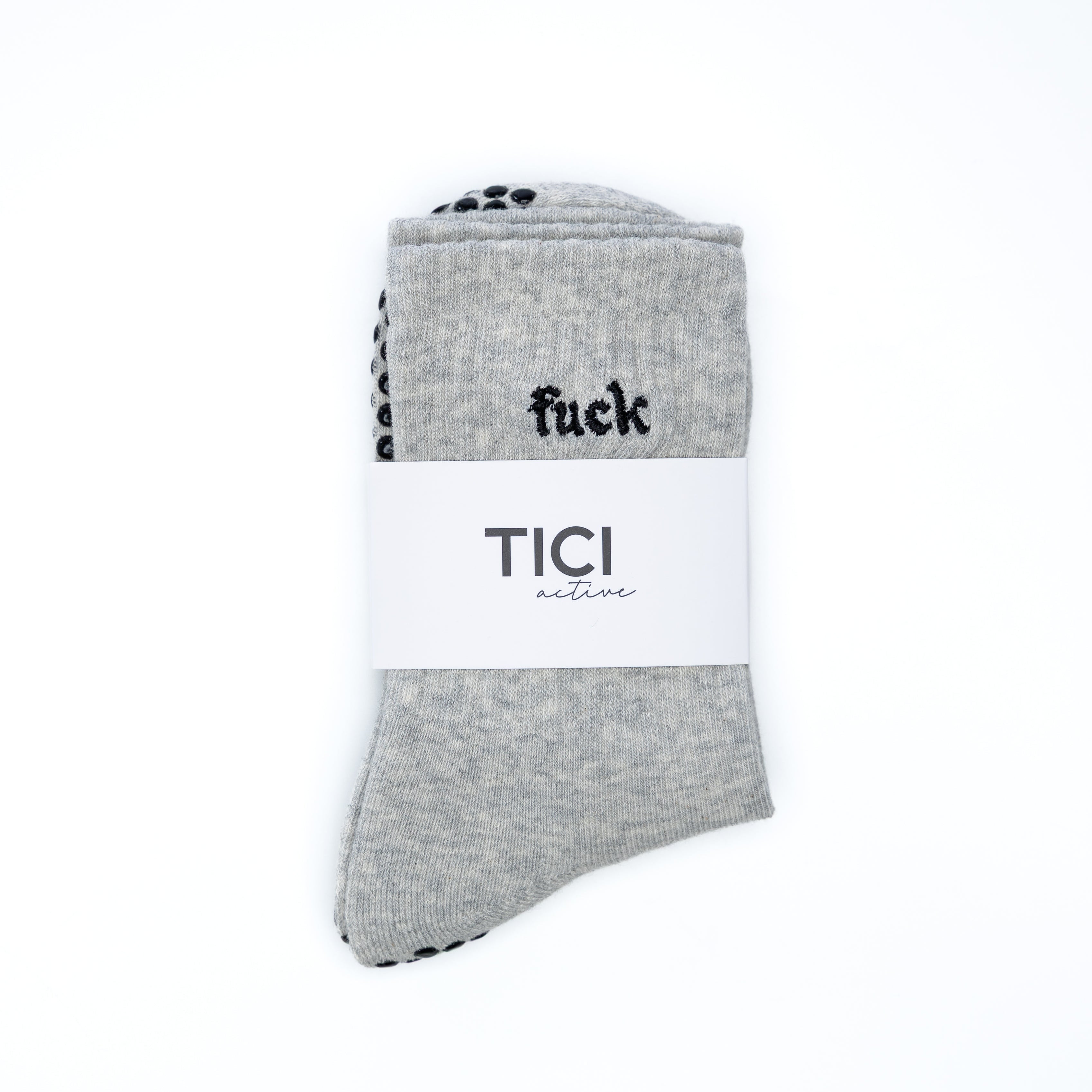 Gray grip sock with black text on a white background. tici active non-slip socks for pilates, barre and yoga