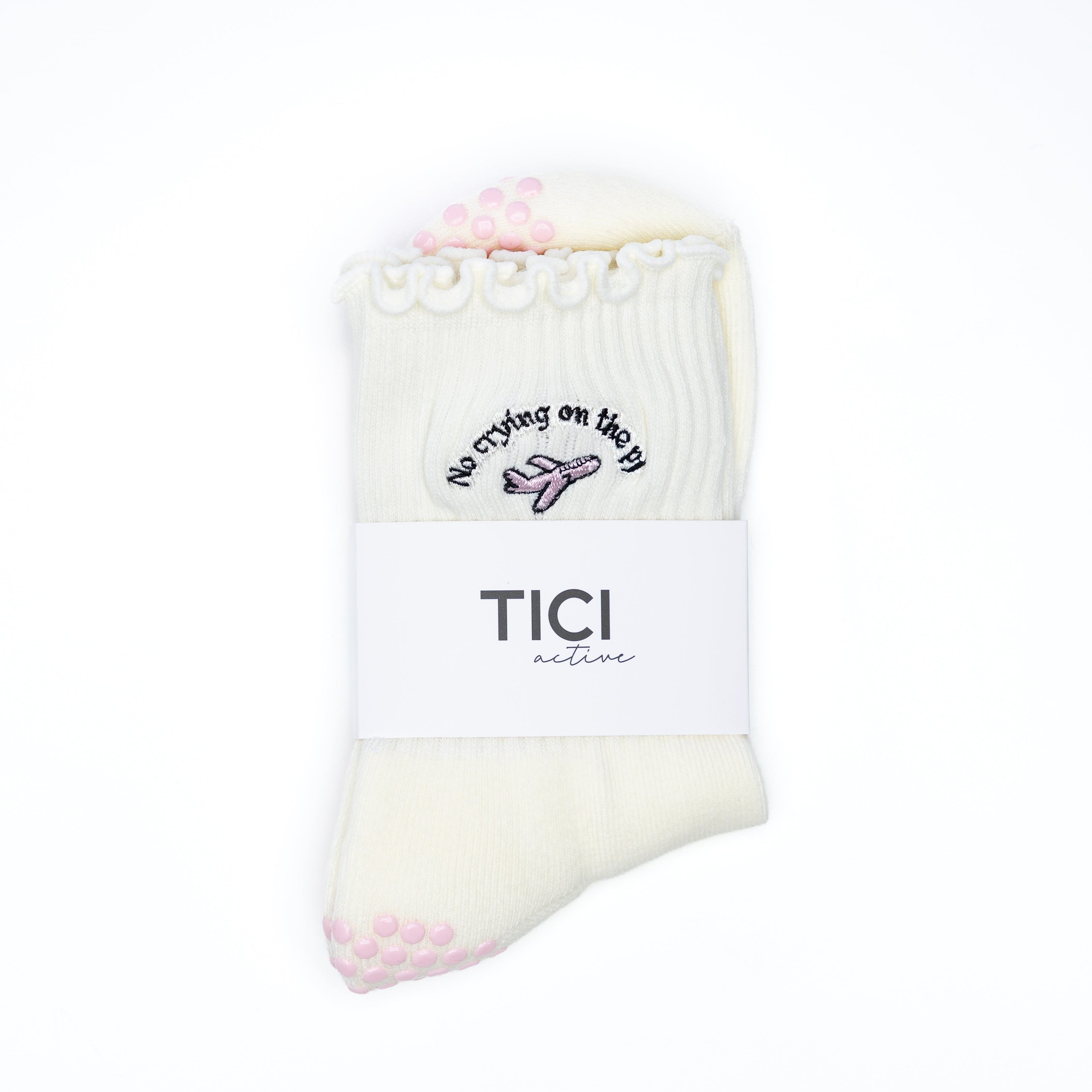 cream GRIP socks with pink GRIPS and 'TICI ACTIVE' branding on a white background. Non-slip socks for pilates, barre and yoga.