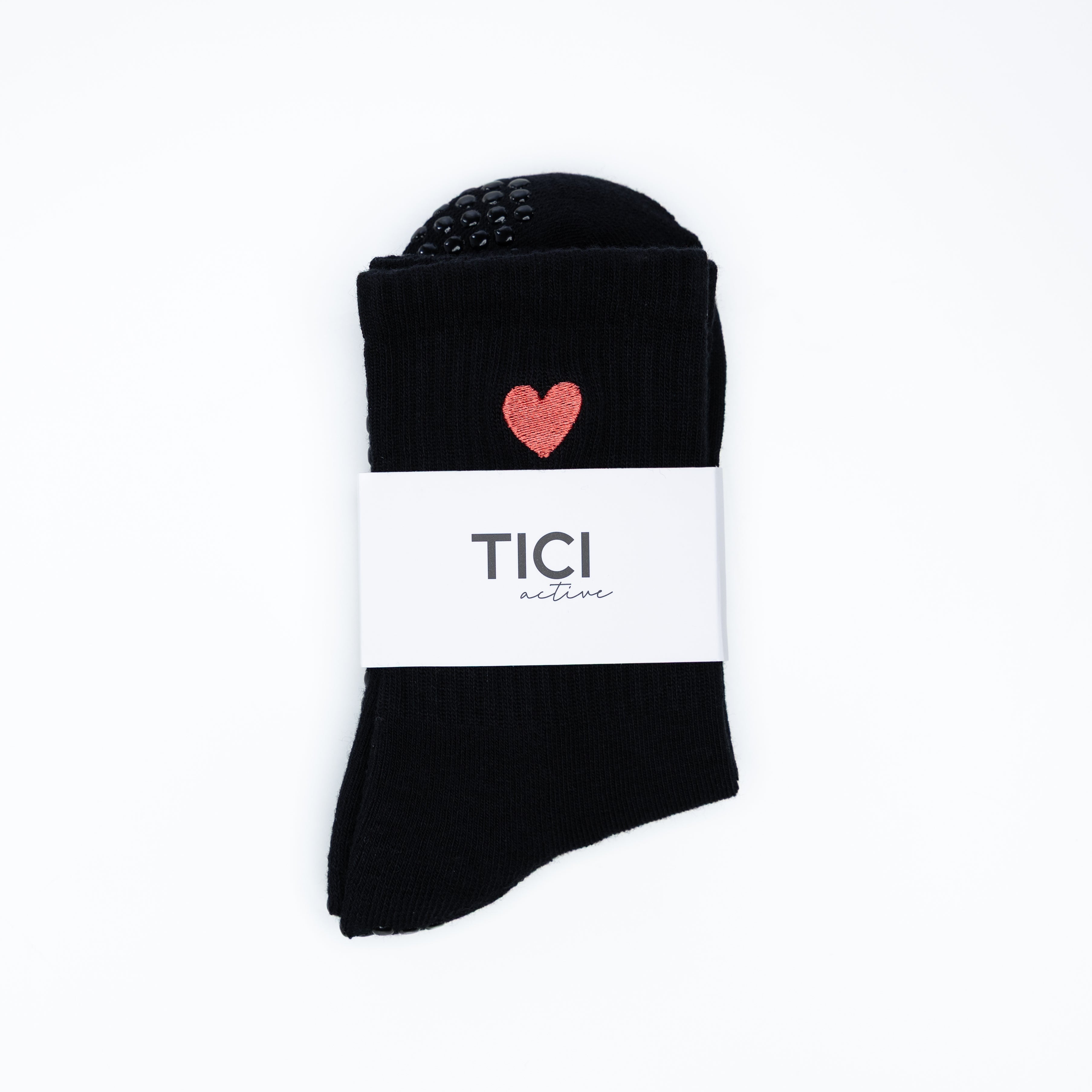 Black grip socks with a red heart embroidery and 'TICI ACTIVE' branding on a white background
