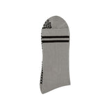 Gray grip socks with black grips and black stripes