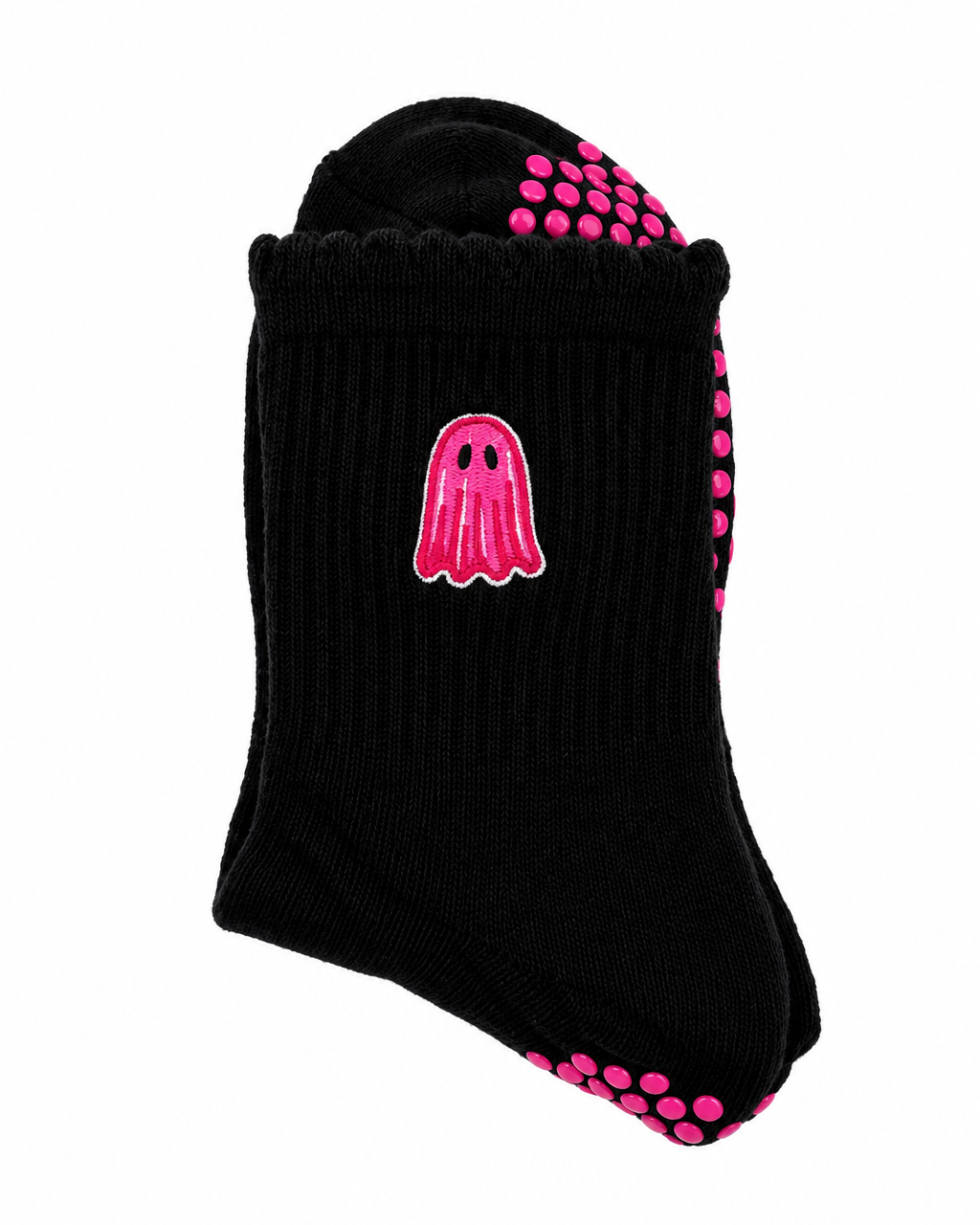 A single black ribbed ankle sock with a pink ghost graphic on the side and pink grip dots on the sole and heel, shown on a plain white background.