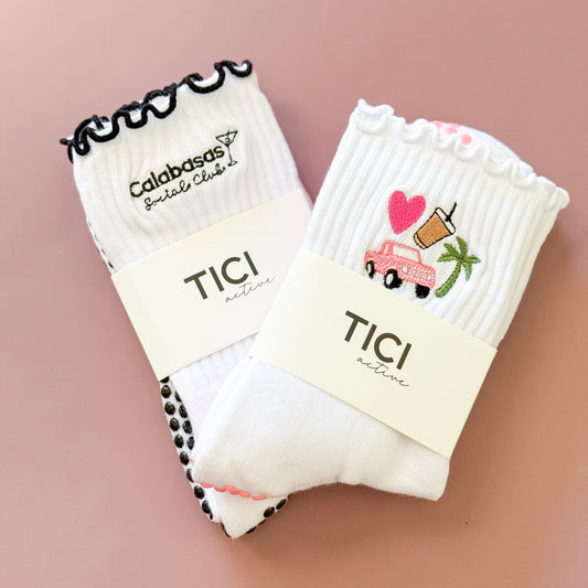 two pairs of grip socks with visible embroidery, tici active grip socks 