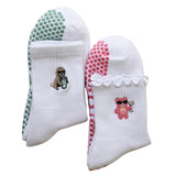 white tici active grip socks. pilates socks with a dog sipping on iced match.  pilates sock with a ink gummy bear holding a cosmopolitan. grip socks for pilates, barre, yoga and lagree.