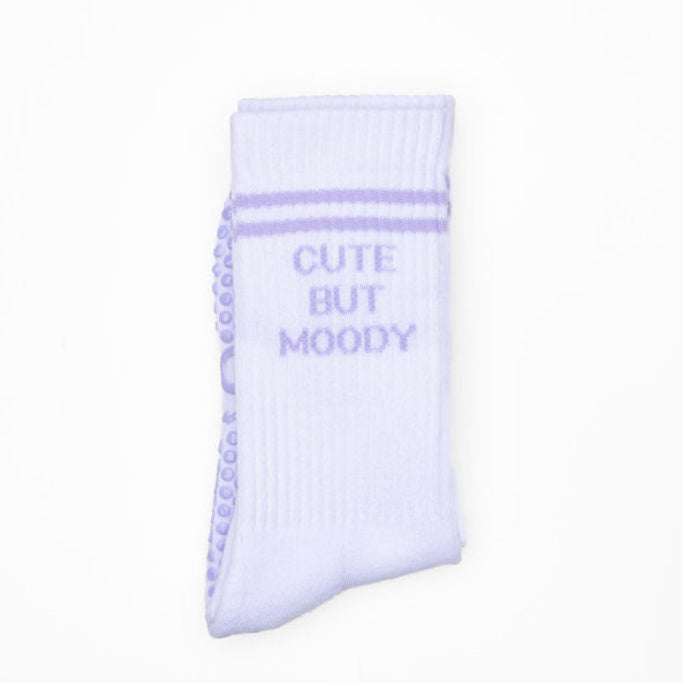 Light purple sock with 'Cute But Moody' text on a white background