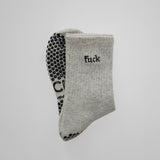 Gray grip socks with black text and 'TICI ACTIVE'  branding on a white background. Grip socks are heather gray with black grips. 