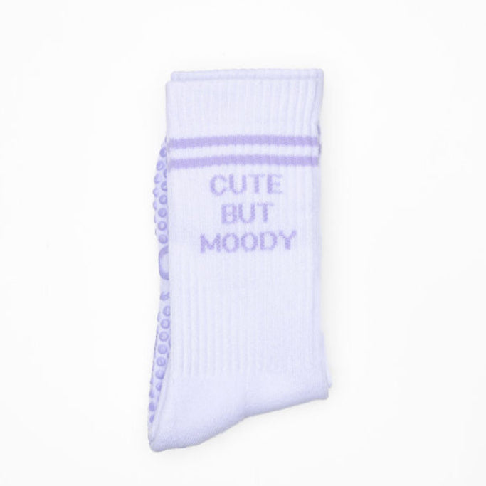Light purple sock with 'Cute But Moody' text on a white background