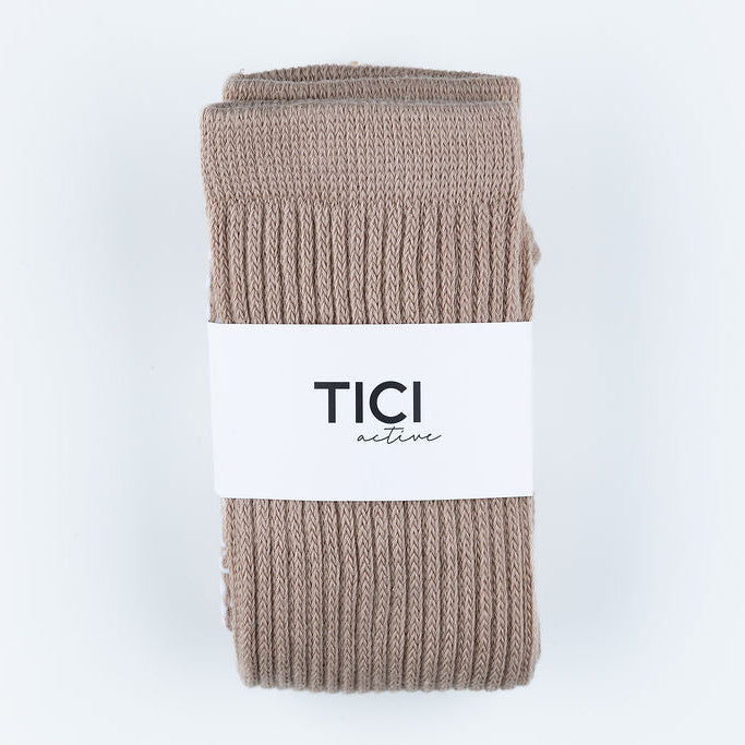 Folded beige sock with 'TICI active' label on a light gray background grip socks CRUNCH SOCKS 
